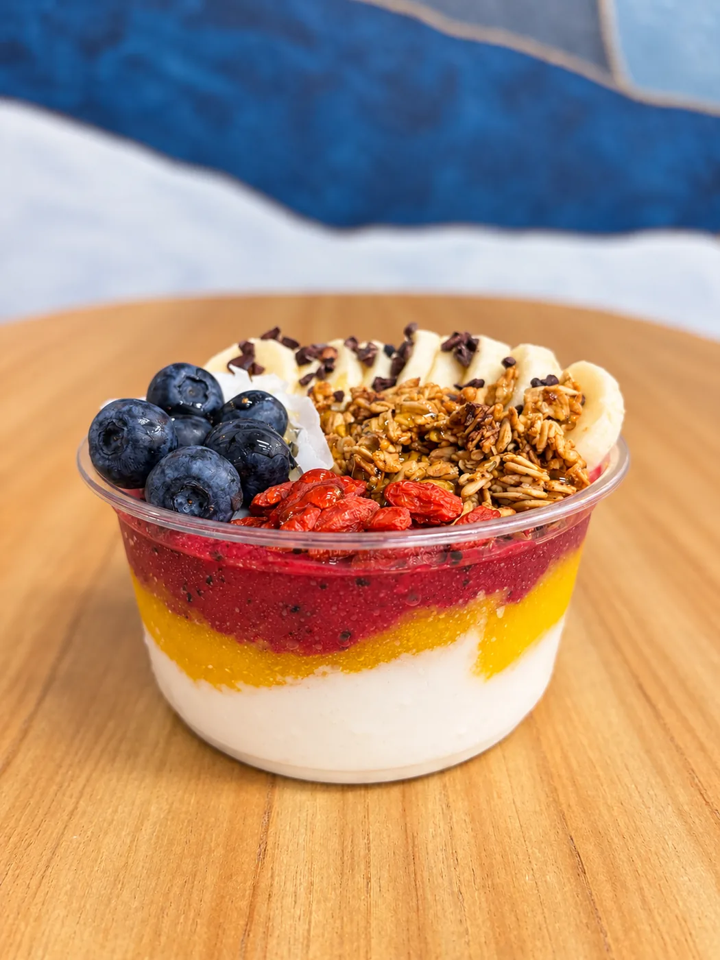 Superfood açaí bowl with blueberries, banana, granola and goji berries